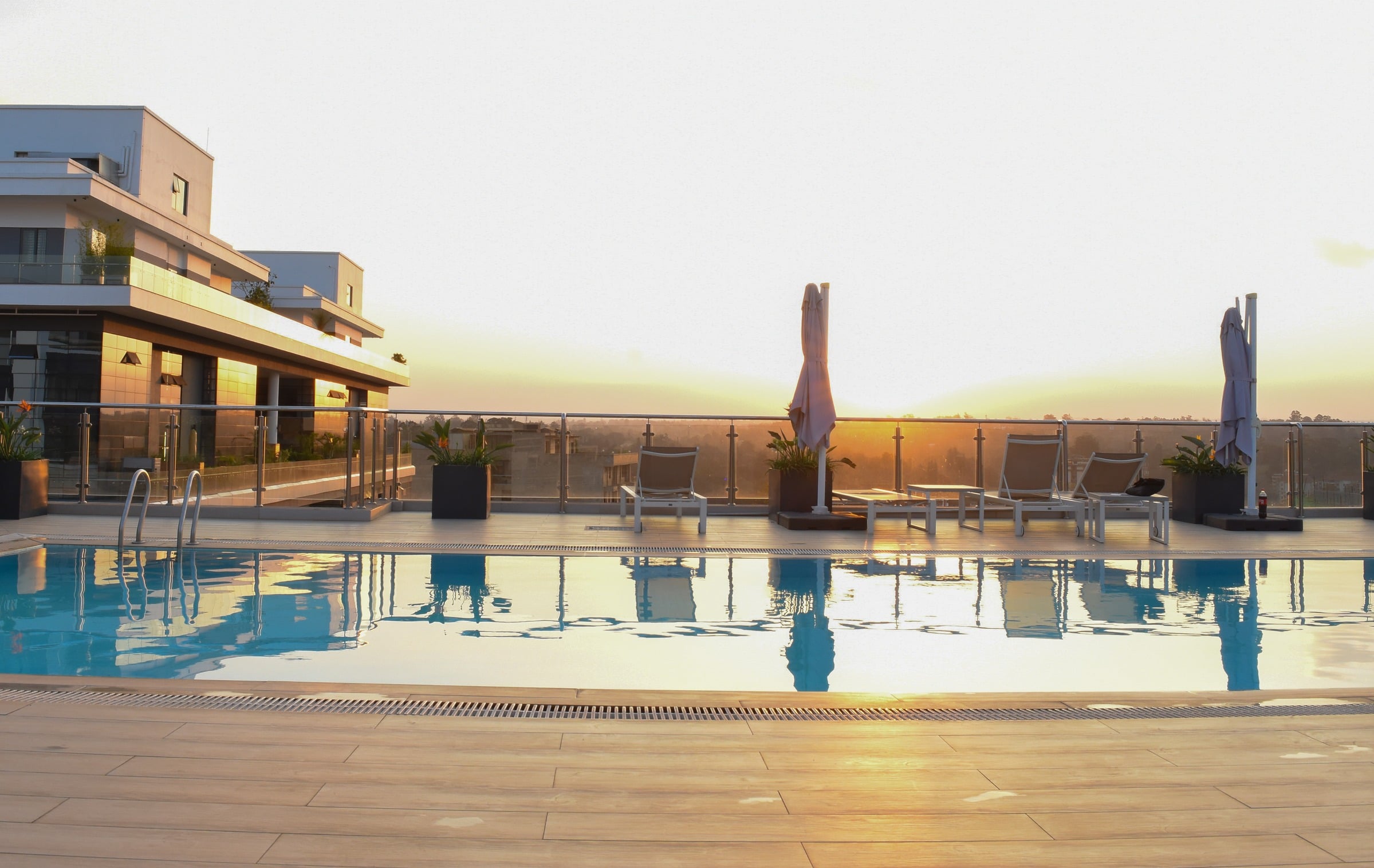 The rooftop pool at Riverside Square at sunset, overlooking Nairobi