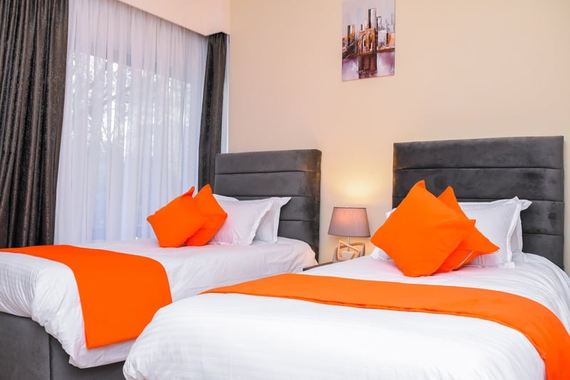 The Solara — bedroom two, twin beds that can be joined