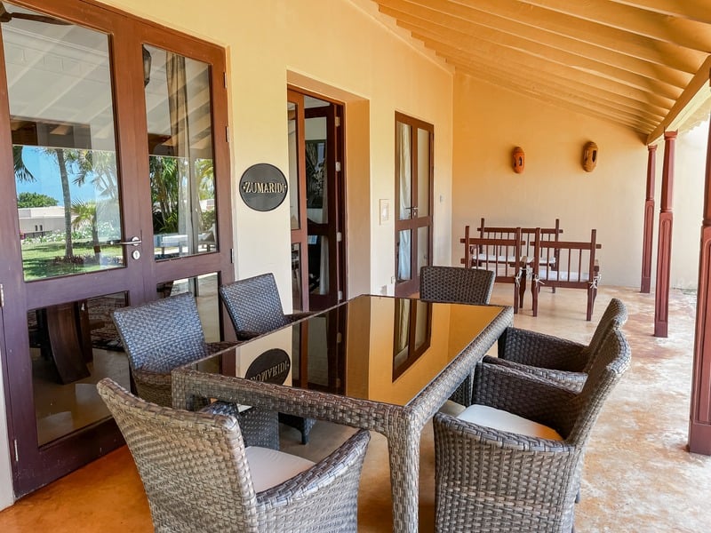 The Maridi Villa — covered terrace with the dining set